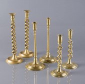 BRASS CANDLESTICKSThree pairs