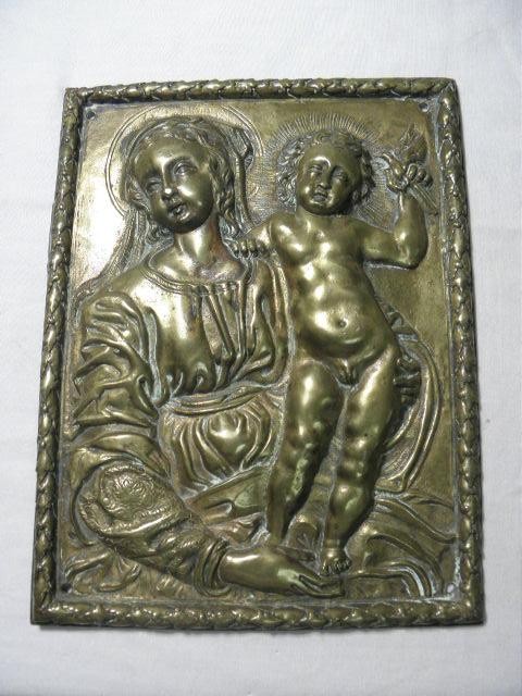 Brass figural relief wall plaque.