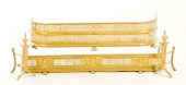 Brass fireplace fenders and an