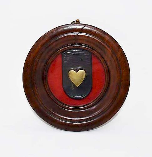 BRASS HEART ON A LEATHER STRAP