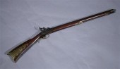 BRASS-MOUNTED ANTIQUE RIFLE. S