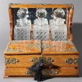 BRASS MOUNTED OAK TANTALUS WIT