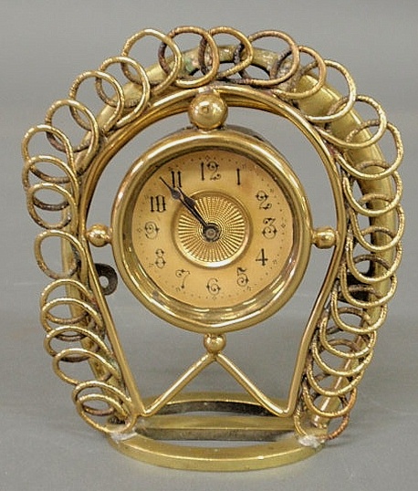 Brass saddle stirrup clock marked
