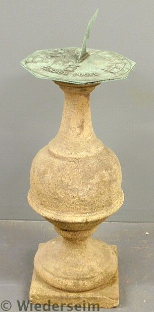 Brass sundial with a cast stone