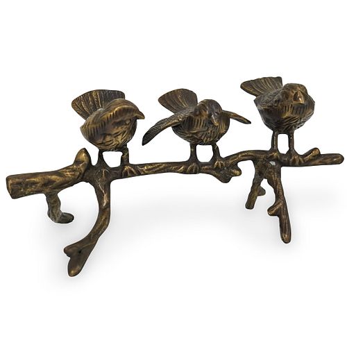BRONZE BIRDS PERCHED ON A