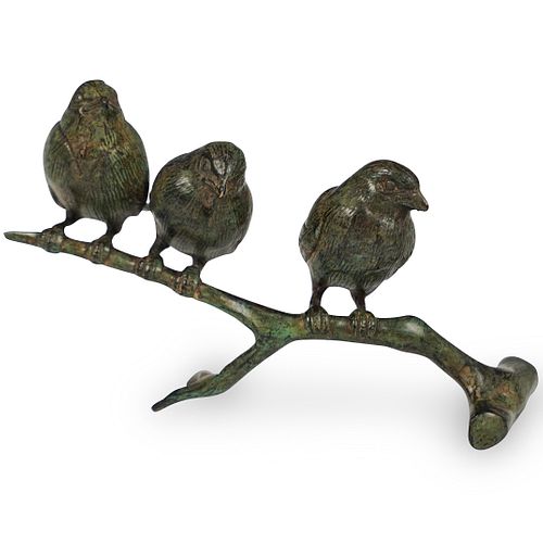 BRONZE BIRDS PERCHED ON A