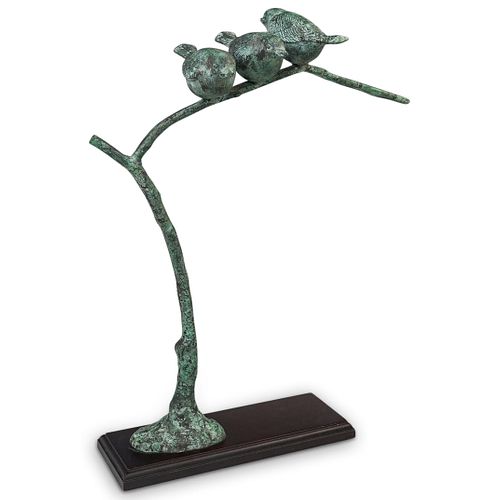 BRONZE BIRDS PERCHED ON