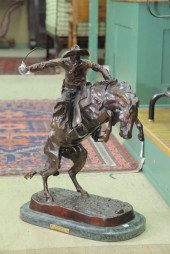 BRONZE BRONCO BUSTER SCULPTURE