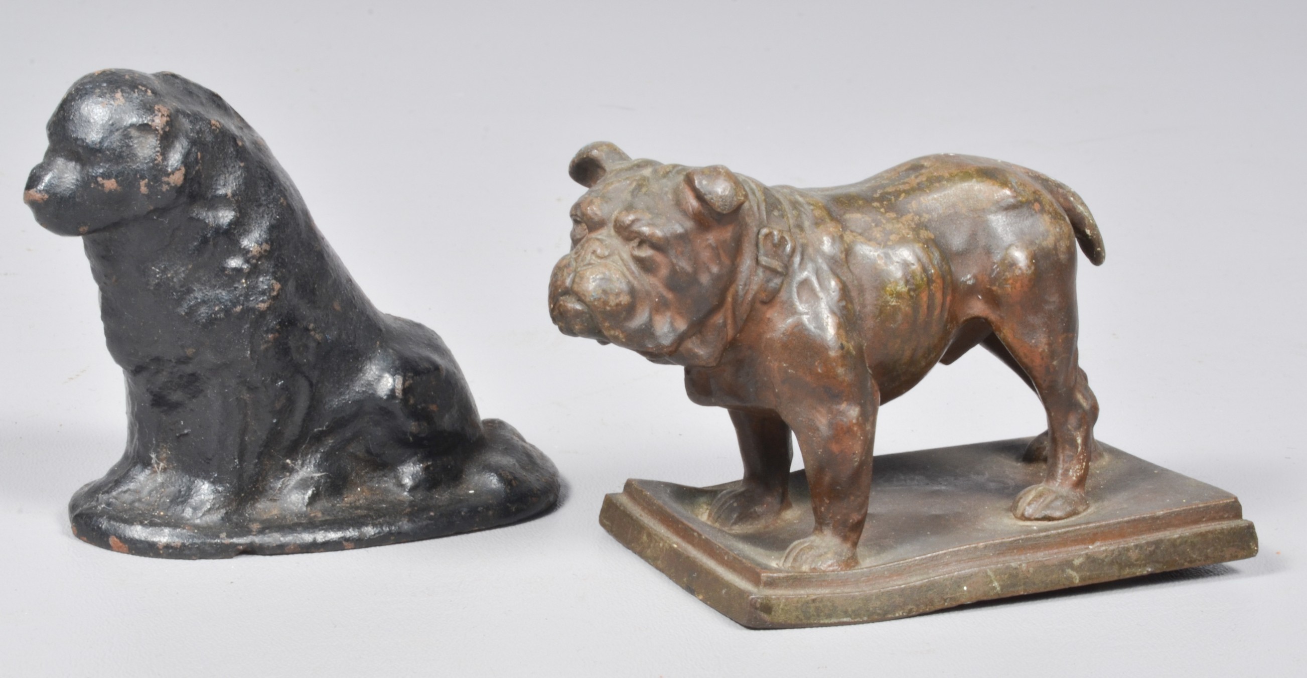 Bronze bulldog and iron doorstop to