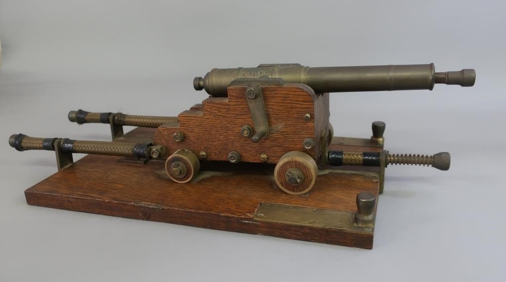 Bronze cannon with oak truck and