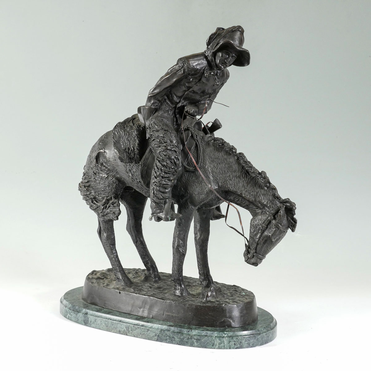BRONZE COWBOY ON HORSEBACK AFTER