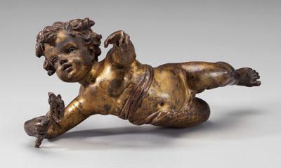 Bronze cupid in flight, torch in