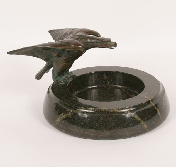 Bronze eagle perched on marble