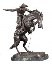 BRONZE FIGURAL GROUP OF "BRONC