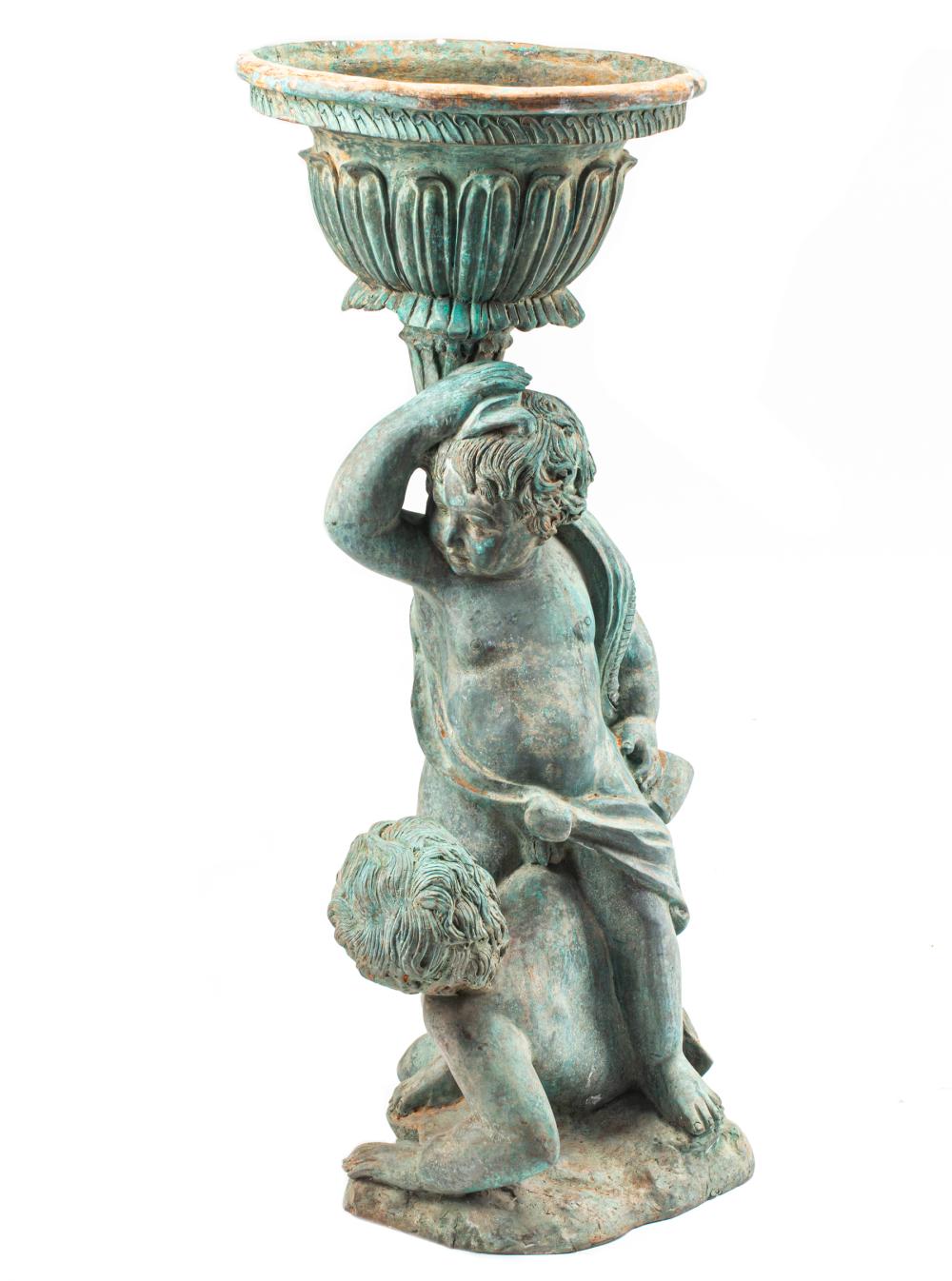 BRONZE FIGURE OF A BOY HOLDING A