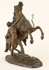 BRONZE FIGURE OF A MAN WITH RE