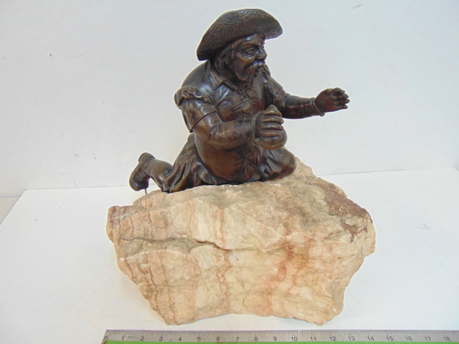 BRONZE FIGURE OF A MINER OR