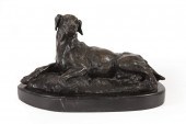 BRONZE FIGURE OF A RECUMBENT D