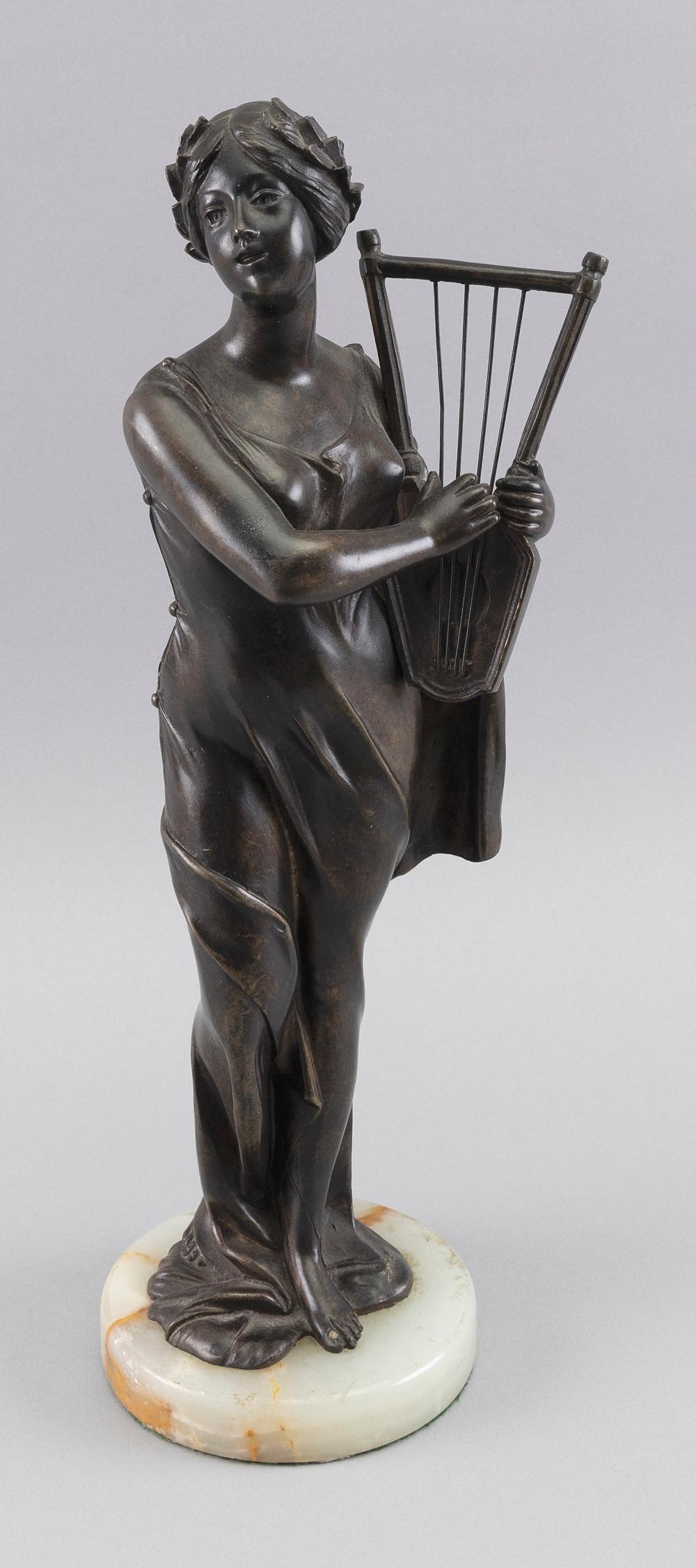 BRONZE FIGURE OF A WOMAN WITH A
