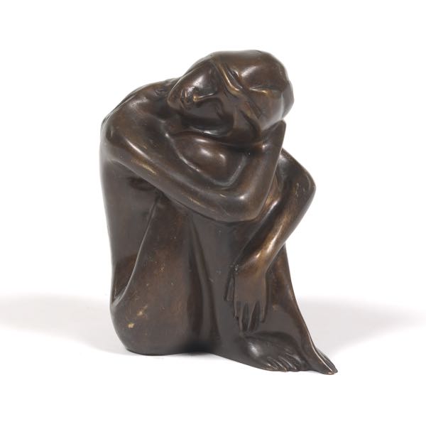 BRONZE FIGURINE OF A SEATED NUDE