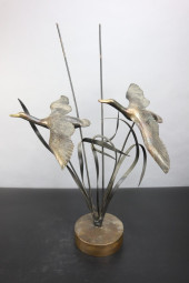 BRONZE GEESE FLYING ABOVE VEGE