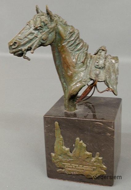 Bronze horse head mounted on a
