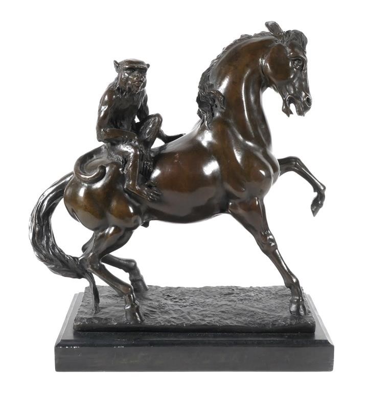 BRONZE MONKEY RIDING A HORSE