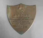 BRONZE PLAQUE AWARDED TO J.B.