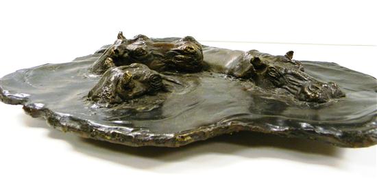 Bronze plaque of three hippos in