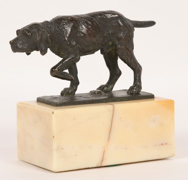 Bronze pointer on marble base;