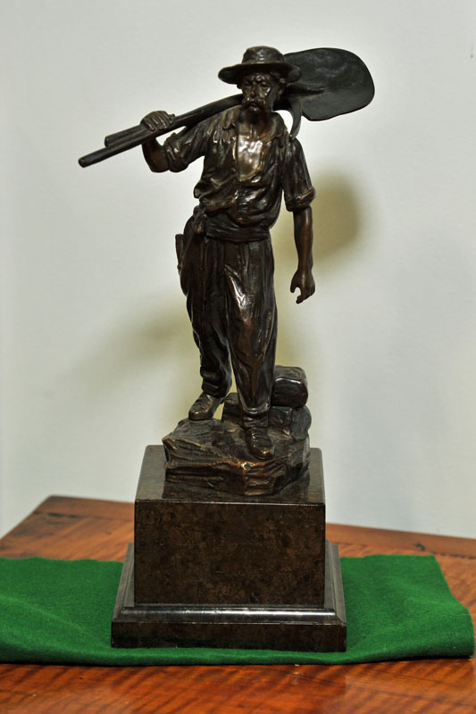 BRONZE SCULPTURE. Depicting a miner