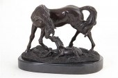 Bronze sculpture of mare and f