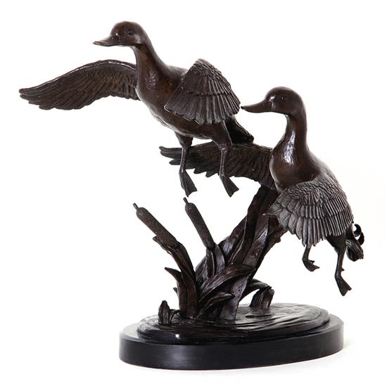 Bronze sculpture of rising ducks