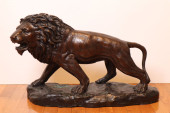 BRONZE STALKING LION SCULPTURE