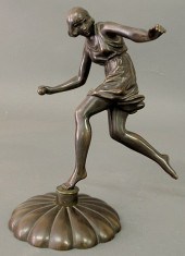 Bronze statue of a girl throwi