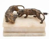 BRONZE TIGERS ON A LIGHTED ALA