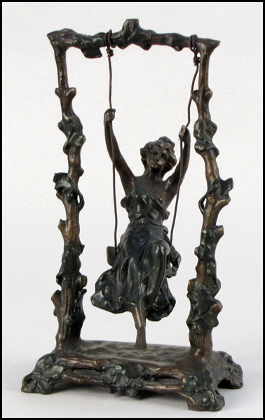 BRONZE WOMAN ON A SWING (20TH