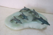 BRONZED METAL DOLPHINS ON GREE