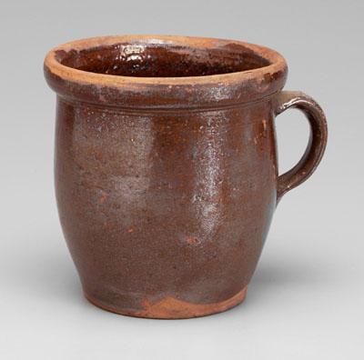 Brown-glazed redware cream/milk