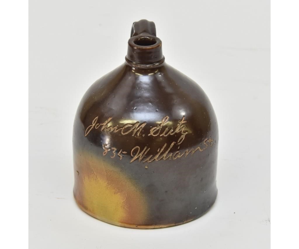 Brown stoneware jug inscribed 'John