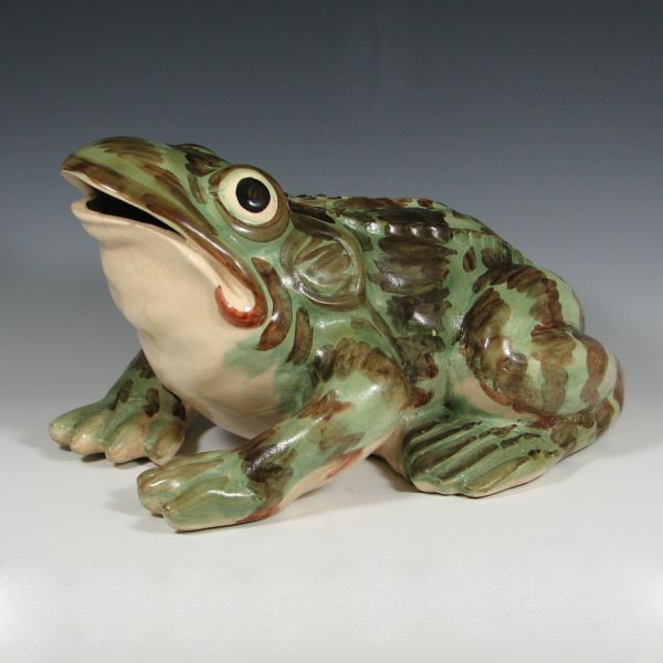 Brush lawn sprinkler frog with an