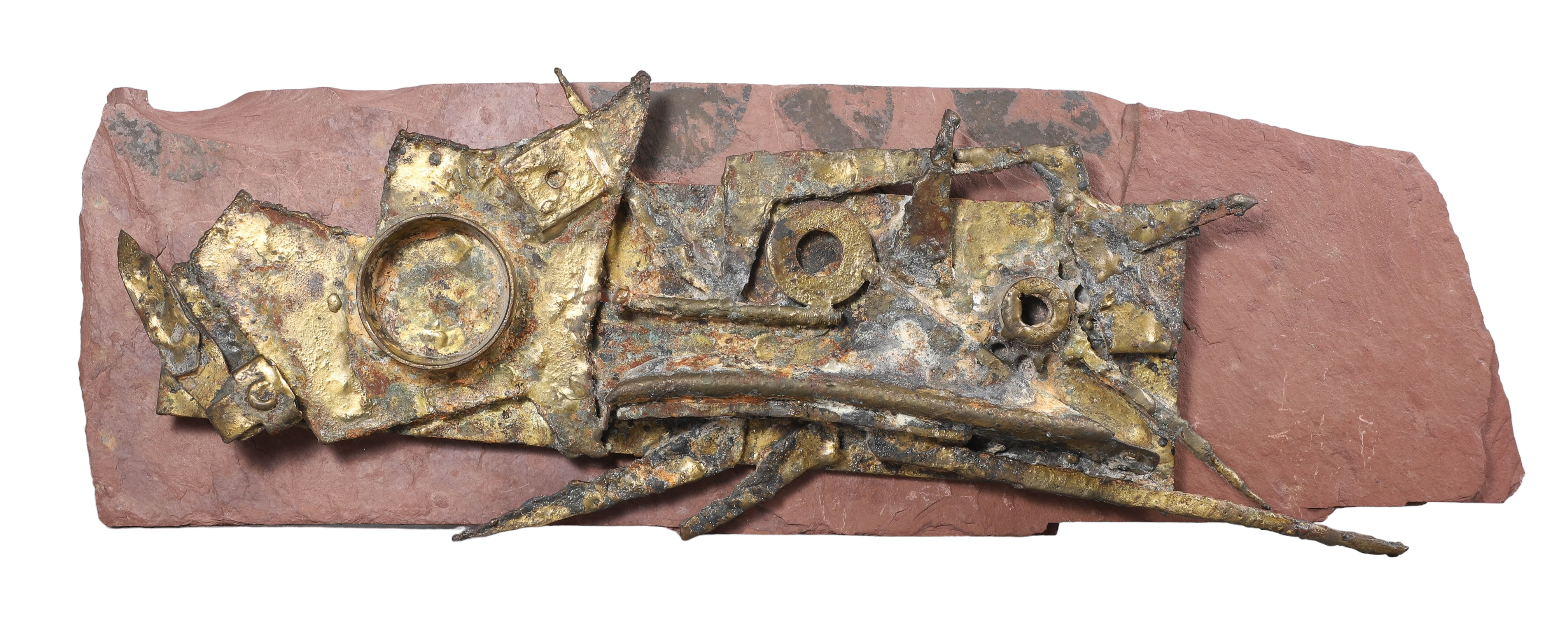 Brutalist metal sculpture on slate,