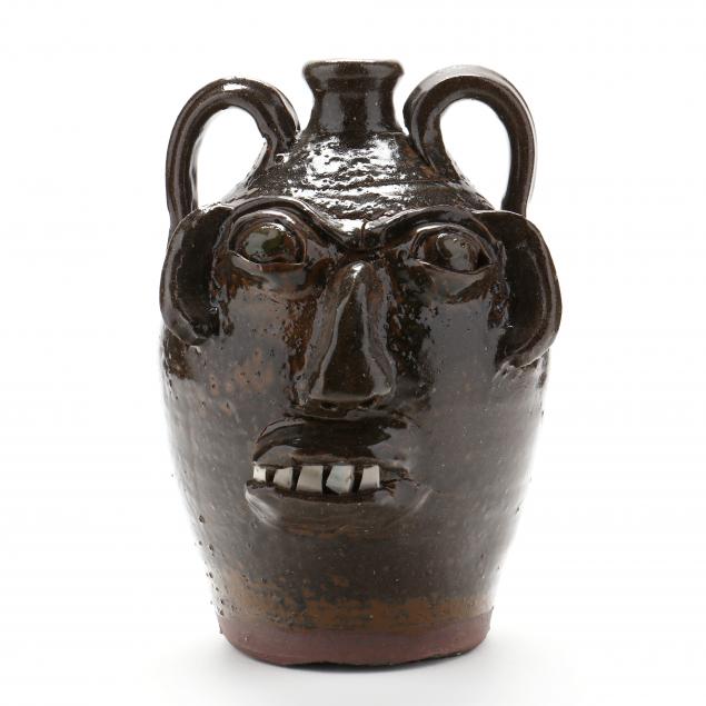 BUGGY JUG WITH GREEN EYES, BURLON