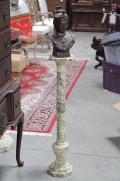 BUST ON STAND. A bronze Buddah