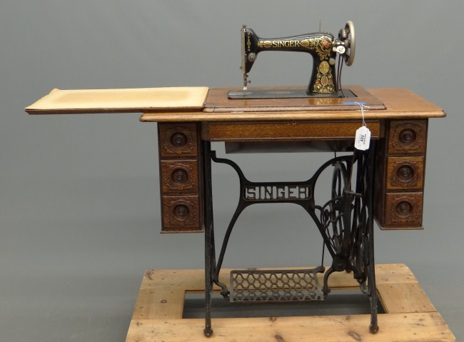 C. 1900's oak case Singer sewing