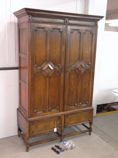 C. 1900's oak two part armoire.