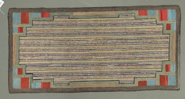 C. 1900's striated hooked rug. 52