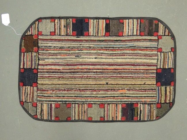 C. 1900's striated hooked rug. 36''