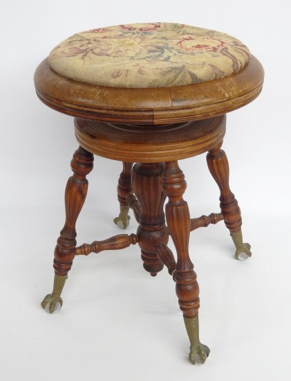 C. 1920's piano stool with brass