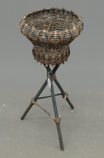 C. 1920's wicker planter in old